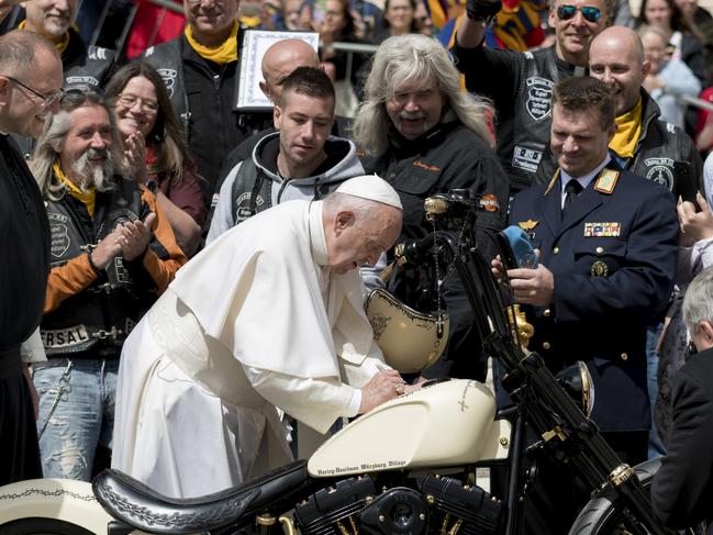 Pope Francis signs a Harley Davidson motorbike – aka ‘Holy Davidson’ – brought by members of an association of Jesus Bikers International who attended his weekly general audience, in St. Peter's Square at the Vatican, on May 29, 2019. Picture: NurPhoto via Getty Images