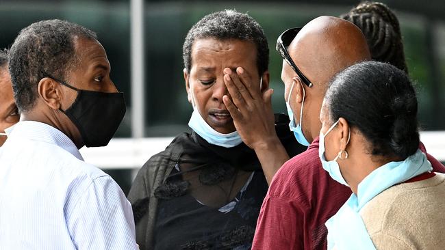 Family and friends linked to the case of 13 men who are charged with the murder of 19-year-old Girum Mekonnen during a brawl in September 2020 leave Brisbane Magistrates Court in February 2022. Picture: NCA NewsWire/Dan Peled