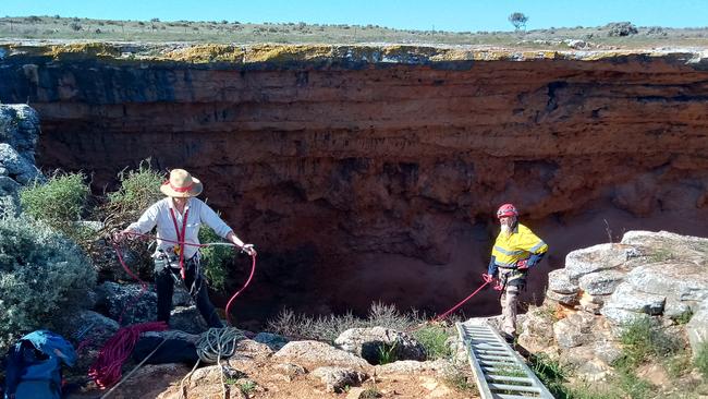 Dr Walshe, left, and custodian Anton Mundy at Koonalda Cave in South Australia.