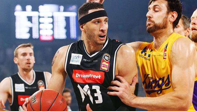 Melbourne United’s Josh Boone competes for the ball against Kings big man Andrew Bogut. Picture: Getty