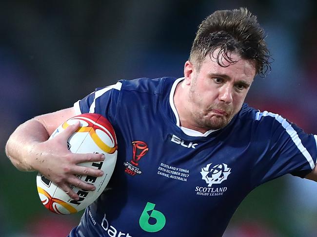 CAIRNS, AUSTRALIA - OCTOBER 29:  Ben Hellewell of Scotland is tackled during the 2017 Rugby League World Cup match between Scotland and Tonga at Barlow Park on October 29, 2017 in Cairns, Australia.  (Photo by Chris Hyde/Getty Images)