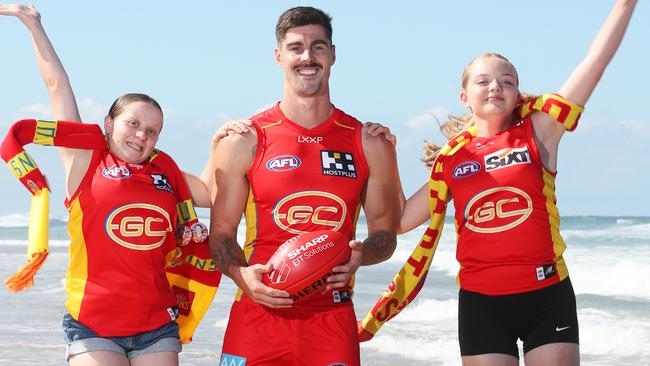 Gold Coast Suns player Alex Sexton with fans Kayla Smith and Bonnie Stott. Picture Glenn Hampson