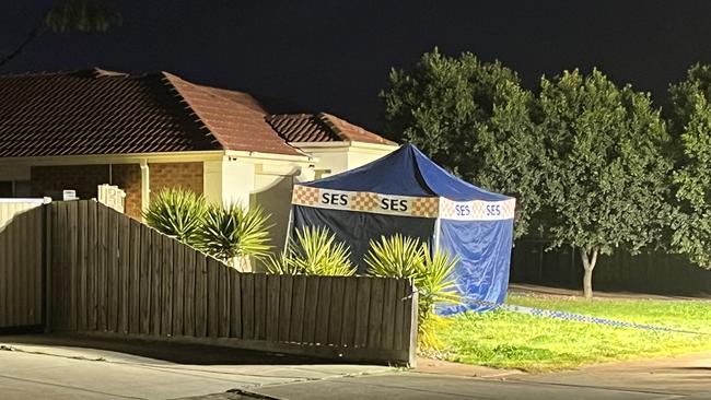 An SES tent with flood lights remained in place about 6.15pm on the driveway of the home set blaze, situated in a quiet residential area. Picture: Nilsson Jones