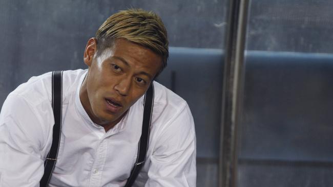 Cambodia's coach Keisuke Honda watches the AFF Suzuki Cup match against Laos