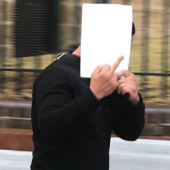 A camera-shy Mohamad Alameddine leaves Campbelltown Court last month.