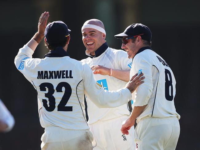 Jayde Herrick celebrates the wicket of Steve Smith with Glenn Maxwell and David Hussey in a Sheffield Shield match at the SCG.