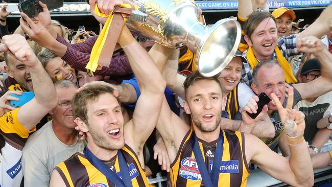 Grant Birchall (left) and Jack Gunston celebrate Hawthorn’s 2014 premiership victory over Sydney. Picture: Alex Coppel.