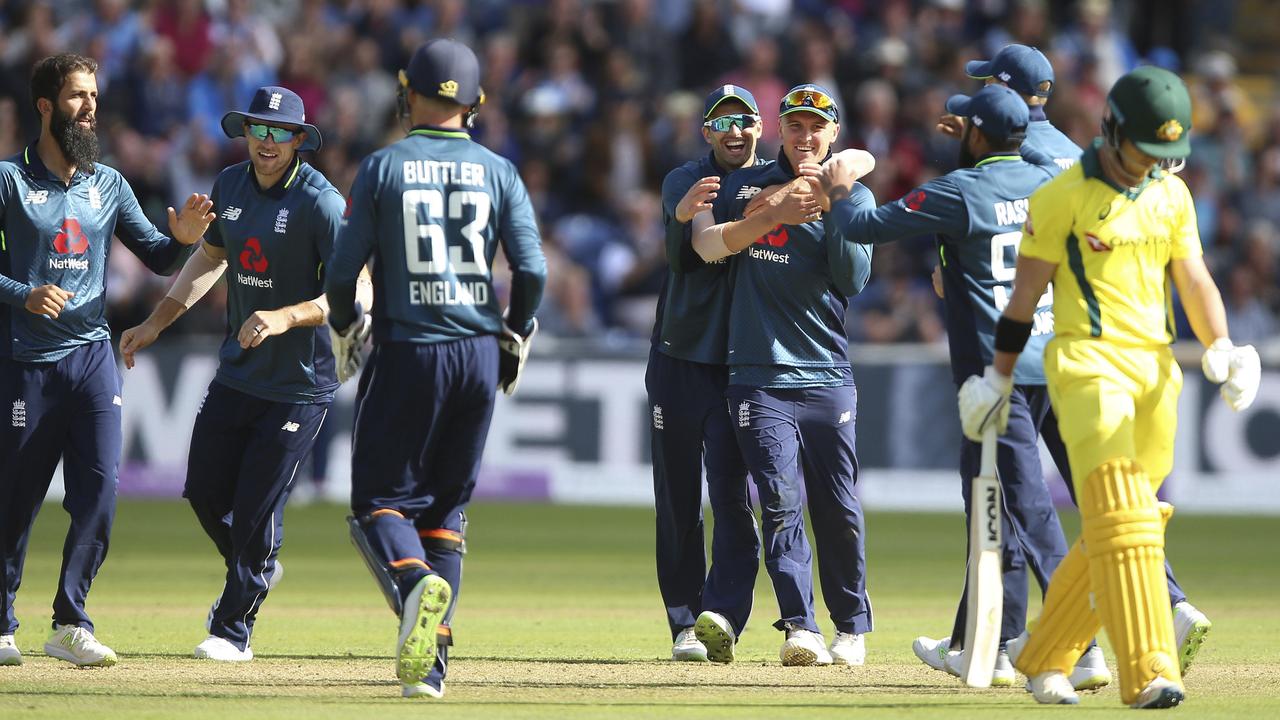 England players celebrate after taking the wicket of Australia's D'Arcy Short.