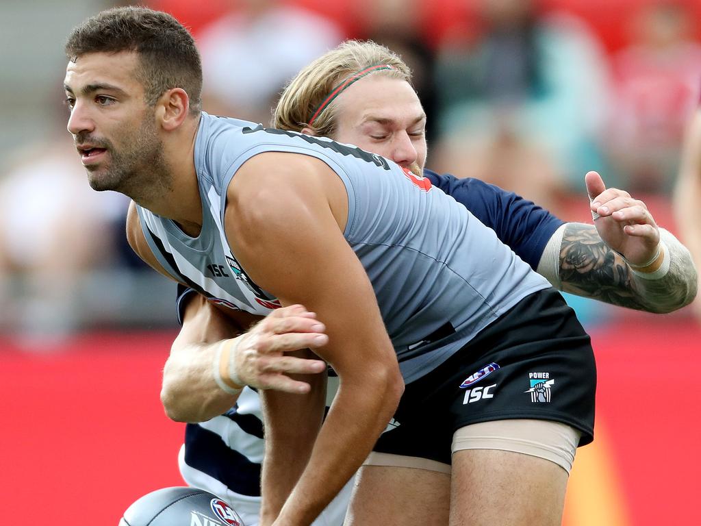 15/02/18 AFLX at Hindmarsh Stadium. Port Adelaide Power v Geelong - Jimmy Toumpas tackled by Tom Stewart. photo Calum Robertson