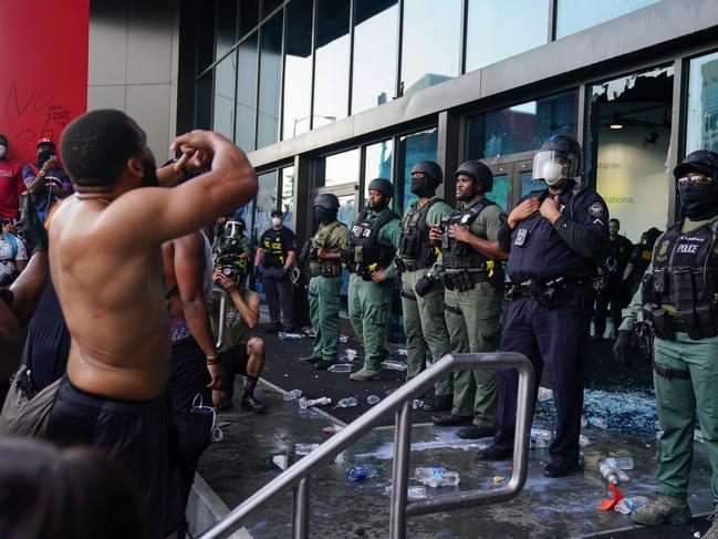 Police officers guard CNN Center during a protest on May 29 in Atlanta, Georgia. Picture: Elijah Nouvelage