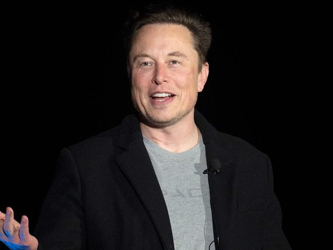 (FILES) In this file photo taken on February 10, 2022 Elon Musk gestures as he speaks during a press conference at SpaceX's Starbase facility near Boca Chica Village in South Texas. - Twitter owner Elon Musk on March 17, 2023 put out word that he will make public the long-secret algorithm for recommending tweets. The code used for recommending the posts suggested to users will become "open source" at the end of March, Musk said in a tweet of his own. (Photo by JIM WATSON / AFP)