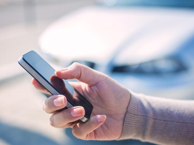 Woman using smart phone and call the car insurance