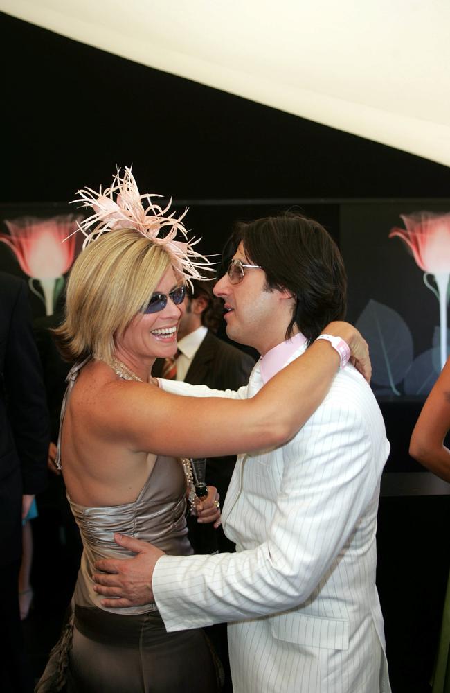 Model &amp; TV host Deborah Hutton with actor Nick Giannopoulos as guests in Moet marquee during Derby Day at Flemington in Melbourne.