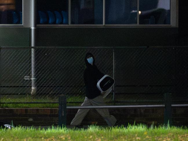 A man seen taking what appears to be a commercial air purifier. Picture: Jason Edwards