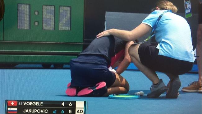 Dalila Jakupovic collapses on court during her Australian Open qualifying match.