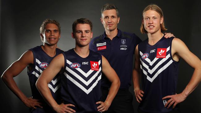 Fremantle coach Justin Longmuir with Liam Henry, Caleb Serong and Hayden Young after the 2019 draft. Picture: Michael Klein