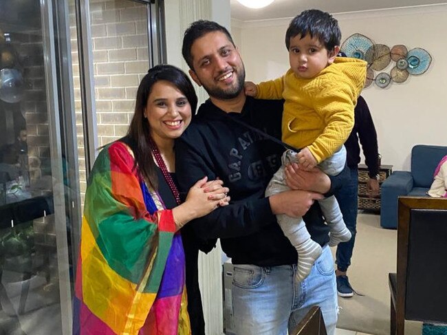 Father Amit Vohra, mother Giggle Sethi and son Vivaan Vohra at their home in Jordan Springs East. Their driveway and front lawn sank as a result of subsidence.