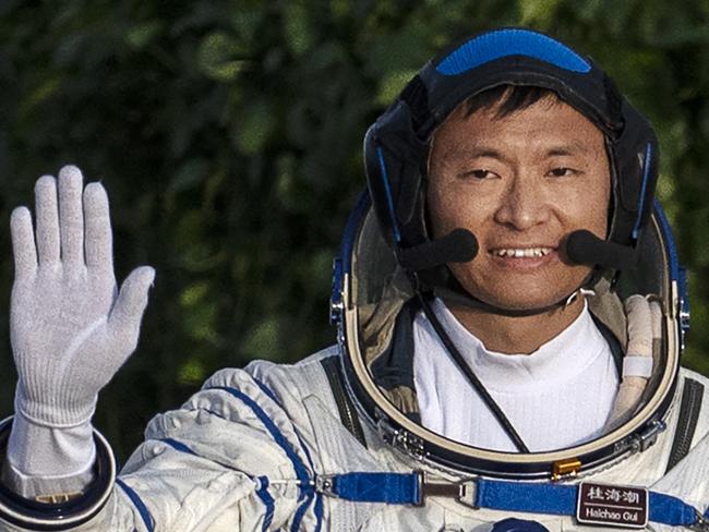 JIUQUAN, CHINA - MAY 30: Chinese Shenzhou-16 mission astronaut and first civilian Gui Haichao waves at a pre-launch departure ceremony early May 30, 2023 at the Jiuquan Satellite Launch Center  in Jiuquan, China. The astronauts will travel on the Shenzhou-16 spacecraft carried by a Long March-2F rocket to China's Tiangong Space Station from the Gobi Desert on May 30 and will stay for six months, relieving the crew that arrived there late in 2022. (Photo by Kevin Frayer/Getty Images)