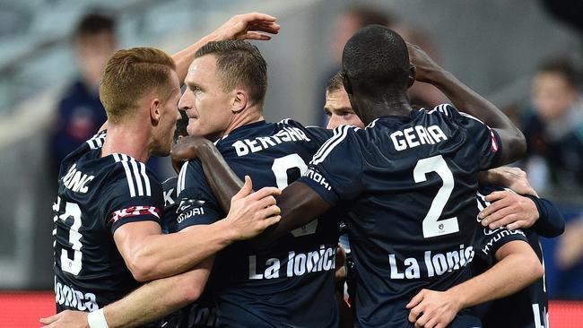 Melbourne Victory players celebrate against Newcastle Jets.
