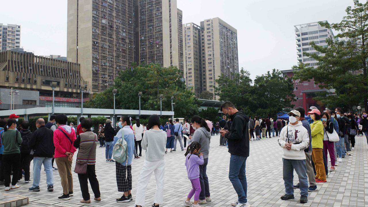 People queue outside a temporary community testing centre which provides free Covid-19 testing services in the Wong Tai Sin area of Hong Kong.