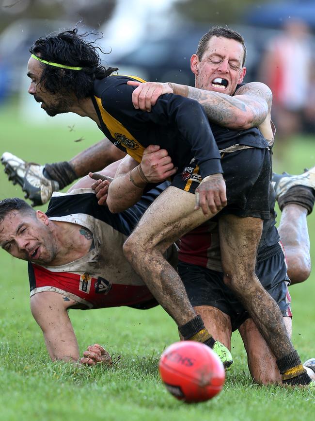 Quambatook players Tobie Cameron, bottom, and Ricky Wild, laying the tackle, will play for rival clubs in the Central Murray next year. Picture: Yuri Kouzmin