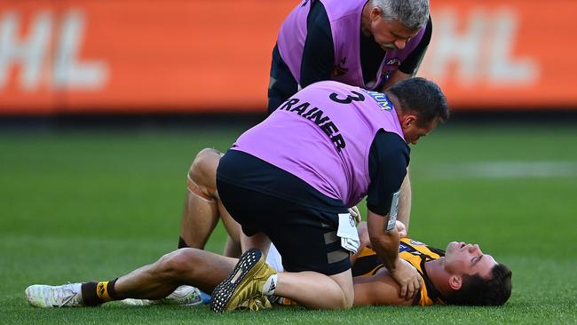 Jaeger O’Meara was attended to by trainers after the collision with Lachie Plowman. Picture: Getty Images