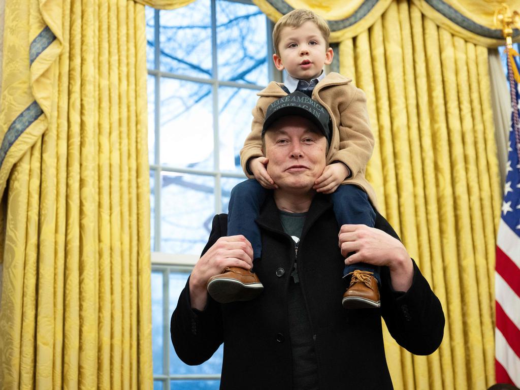 Elon Musk carries his son X on his shoulders in the Oval Office. Picture: AFP