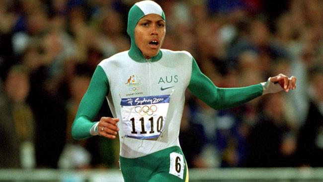 25 Sep 2000:  Cathy Freeman of Australia crosses the line to win gold in the Womens 400m Final at the Olympic Stadium on Day 10 of the Sydney 2000 Olympic Games in Sydney, Australia.  \\ Mandatory Credit: Mike Powell /Allsport