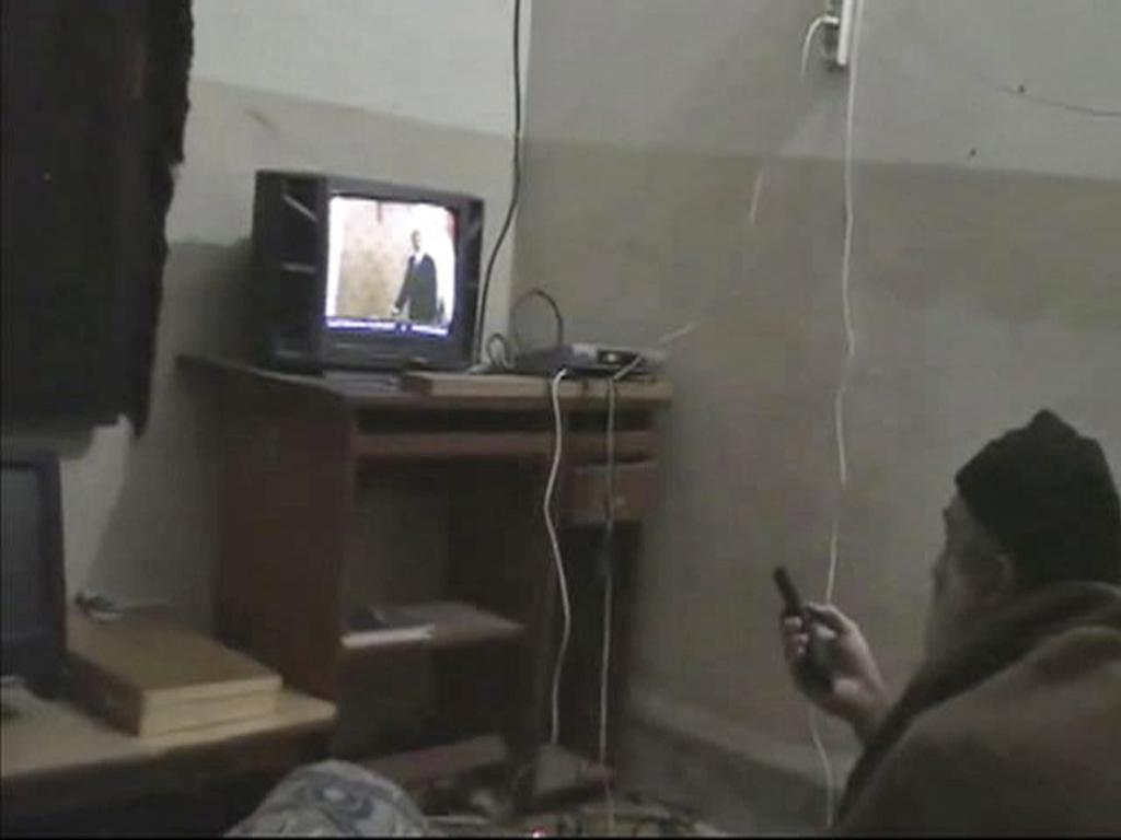 Undated image from video seized from the walled compound of al-Qaeda leader Osama bin Laden in Abbottabad, Pakistan, showing him watching TV. Picture: US Department of Defence