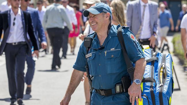 An ambulance officer is all smiles at the Magic Millions race day on Saturday at the Gold Coast Turf Club. Picture: Jerad Williams