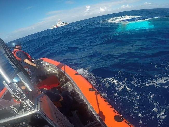 The 37-foot catamaran, Surf into Summer, partially sunk in the Florida Straits. The US Coast Guard rescued Lewis Bennett and searched for Isabella Hellmann.