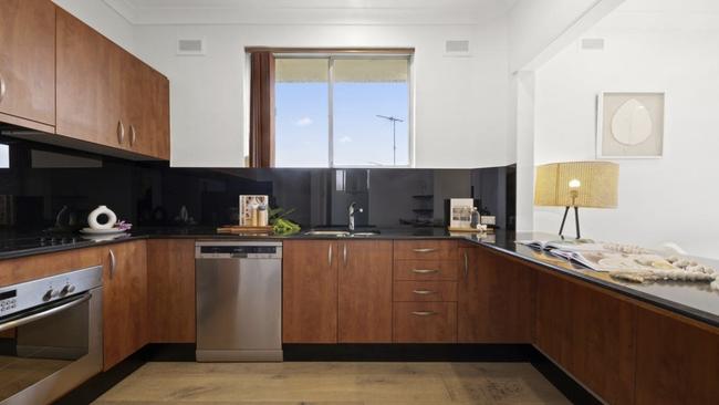 The three-bedroom apartment sits on the top floor of a 1970s block of six. Picture: realestate.com.au