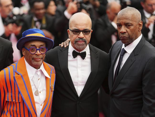 Spike Lee, Jeffrey Wright and Denzel Washington pose for photographers on the red carpet. Picture: AP