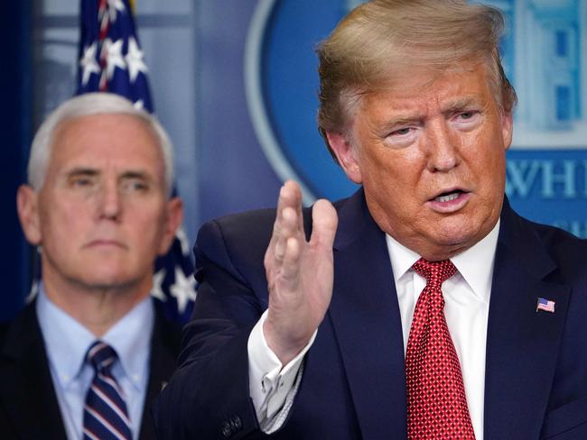 US President Donald Trump speaks during a press conference on the COVID-19, coronavirus, outbreak flanked by US Vice President Mike Pence at the White House in Washington, DC on March 25, 2020. - The number of novel coronavirus cases in the world rose to 85,919, including 2,941 deaths, across 61 countries and territories by 1700 GMT on Saturday, according to a report gathered by AFP from official sources. (Photo by MANDEL NGAN / AFP)