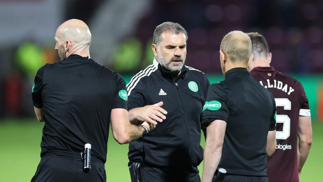 A dejected Ange Postecoglou shakes hands match officials after Celtic’s 2-1 loss to Hearts. Picture: Steve Welsh/Getty Images