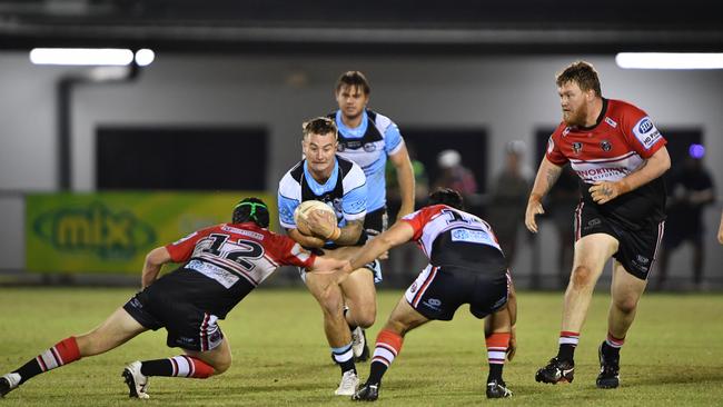 Jayden Sneddon of Northern Sharks take on the Litchfield Bears defence. Picture: Pema Tamang Pakhrin