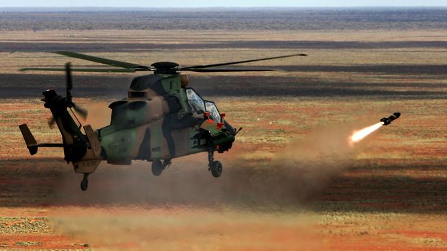 A Tiger Armed Reconnaissance Helicopter firing a Hellfire missile at a target at the Woomera Firing Range. Picture: Supplied/Department of Defence