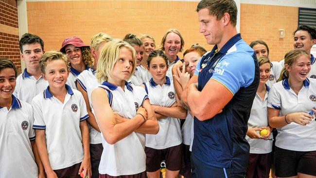 McAuley Catholic College year nine student Logan Trivett squares up with Gold Coast Titans front rower Jarrod Wallace at a recent NRL Community Carnival event at the school. Picture: Matthew Elkerton