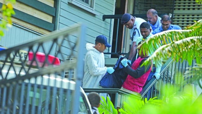 Police carry Jennifer Downes' body from a house in Suva. Picture: Fiji Sun