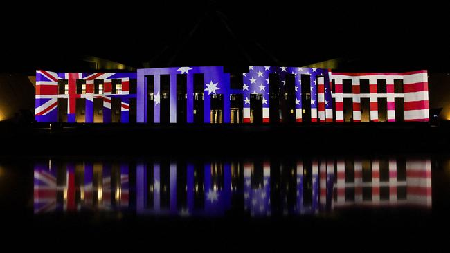 Parliament House is lit up with the Australian and US flags to celebrate the 70th anniversary of the ANZUS Treaty in Canberra on Monday night. Picture: AFP