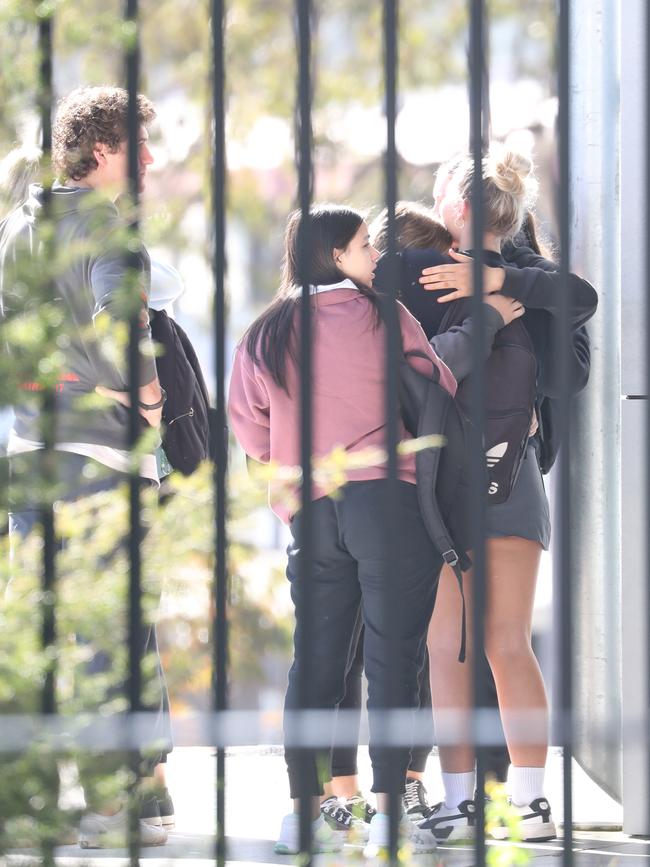 Students hug at Picton High School on Tuesday morning after finding out 5 of their class mates were killed last night. Picture: John Grainger