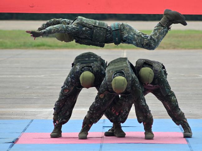 A Taiwanese special forces unit demonstrate their combat skills during a military open house event in Hsinchu on September 21, 2023. (Photo by Sam Yeh / AFP)