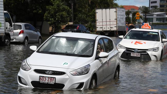 Flooding from the King tide at Budds Beach at Surfers Paradise was made worse by the approaching storm system. Picture Glenn Hampson
