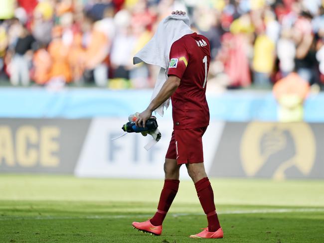 Mat Ryan leaves the field after Australi’s 3-2 loss to the Netherlands in Brazil. (AP Photo/Martin Meissner)