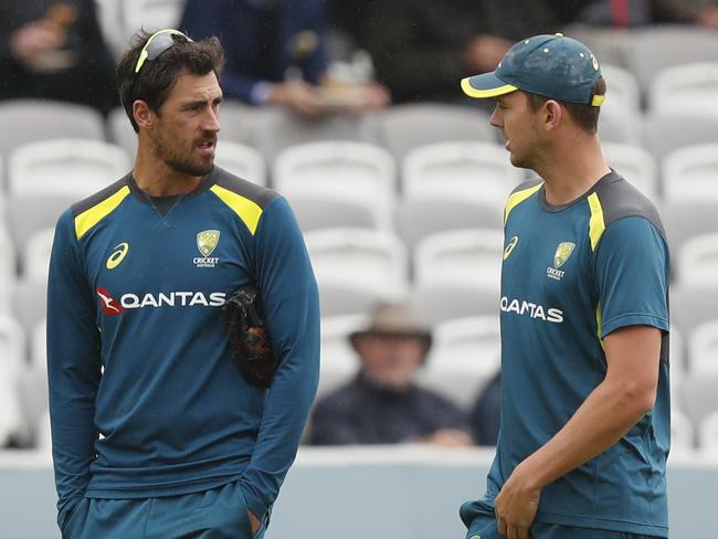 Australia's Mitchell Starc, left speaks to Australia's Josh Hazelwood as they walks from the pitch as rain delays play on day one of the 2nd Ashes Test cricket match between England and Australia at Lord's cricket ground in London, Wednesday, Aug. 14, 2019. (AP Photo/Alastair Grant)