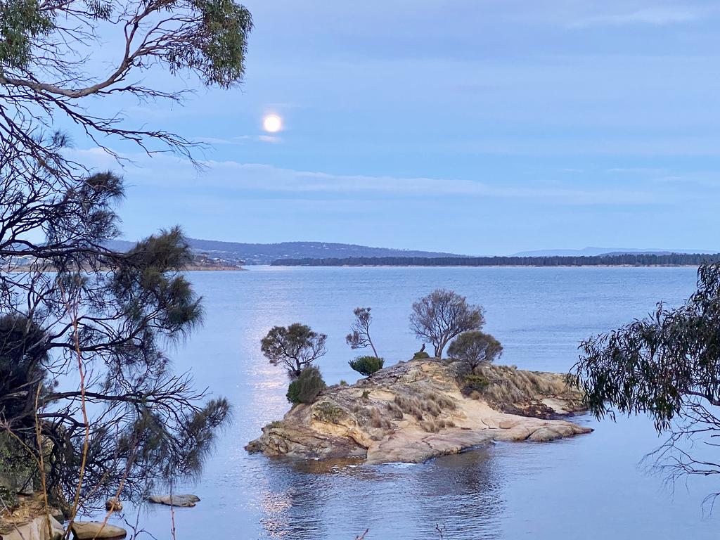 Readers picture for Your Focus on Tasmania. Moon on its way down only a few minutes before the sun was due to set in the opposite direction at Midway Point. Picture: Elly Bolt ***ONE TIME USE ONLY***