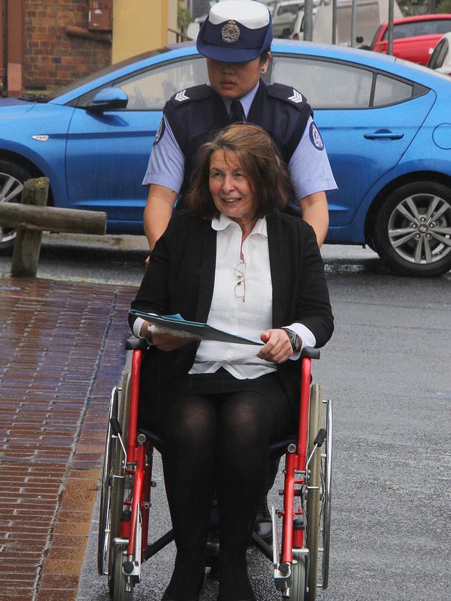 Susan Neill-Fraser arrives at the Launceston Supreme Court in a wheelchair, in 2018. She is eligible for parole this month. Picture: Bruce Mounster