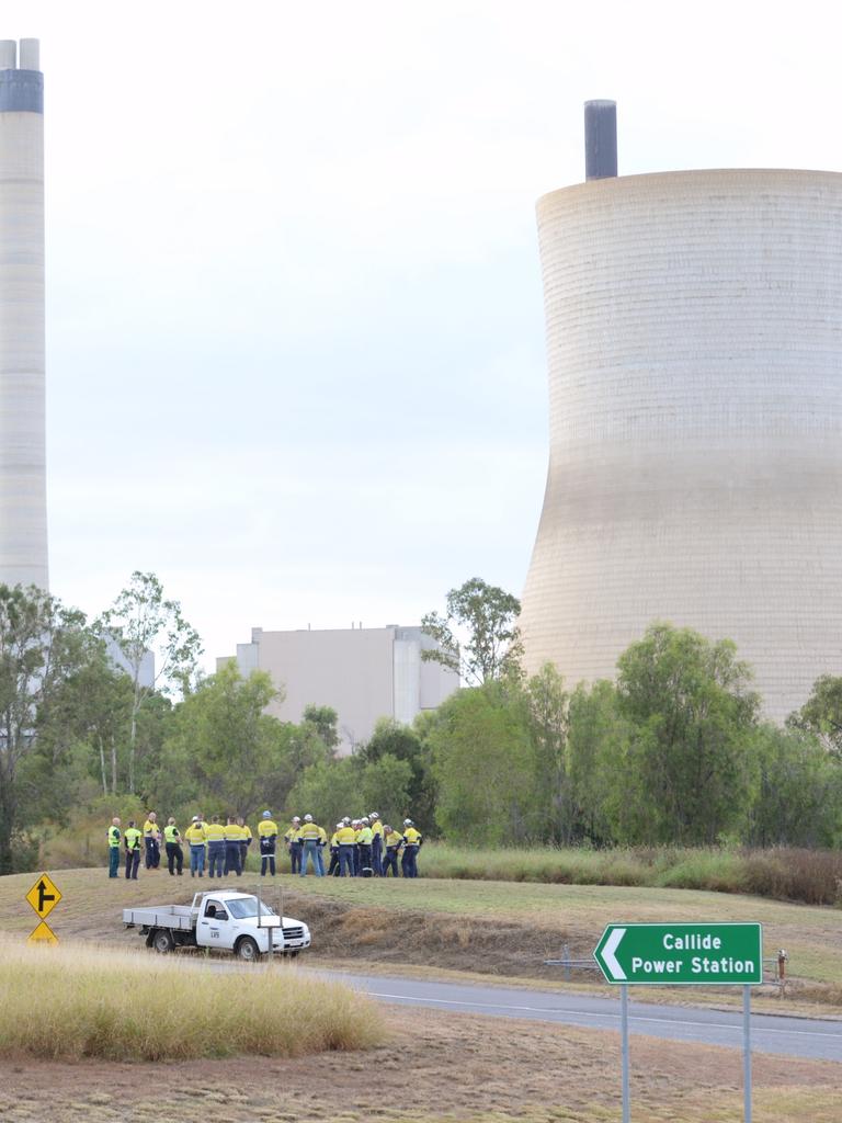 Workers outside the site after the fire in May 2021. Picture: William Debois