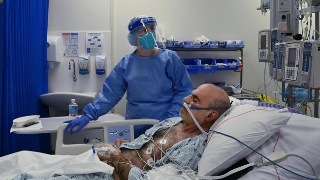 A St Vincent’s Hospital ICU staff member cares for a COVID-19 positive patient. Picture: Supplied/St Vincent’s Hospital