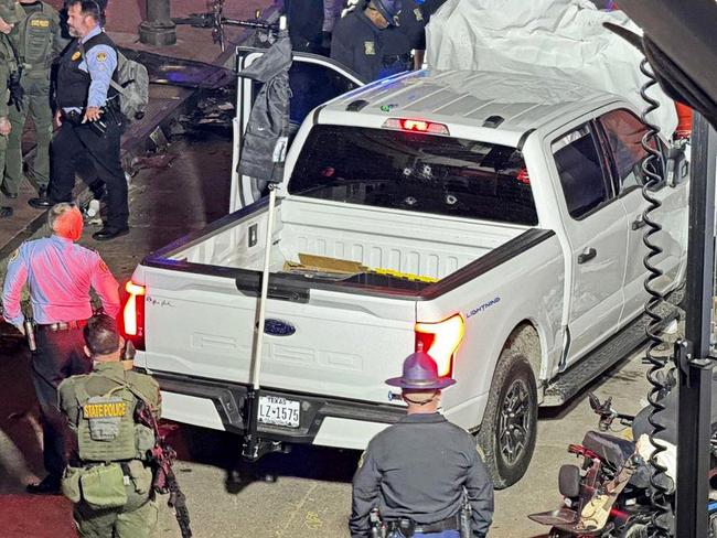 Police and investigators beside the vehicle driven by Shamsud-Din Jabbar in his attack on revellers in New Orleans.